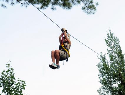 Ann rides the zipline by Chris Polydoroff